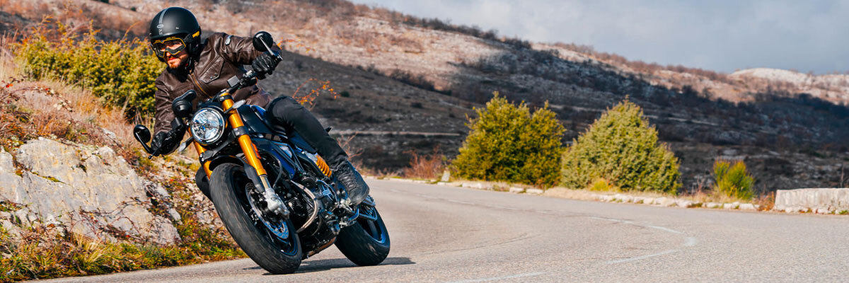 A BMW Motorcycle rider on the way to visit a farm in Southern California.